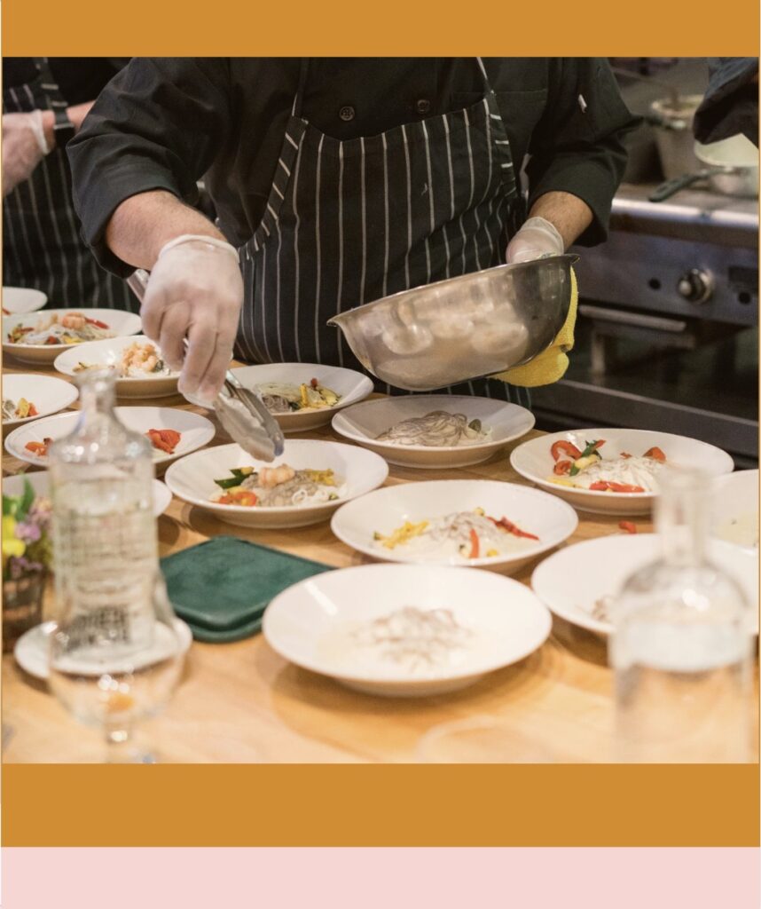 Photo of a chef plating food in a kitchen by Elevate on Unsplash